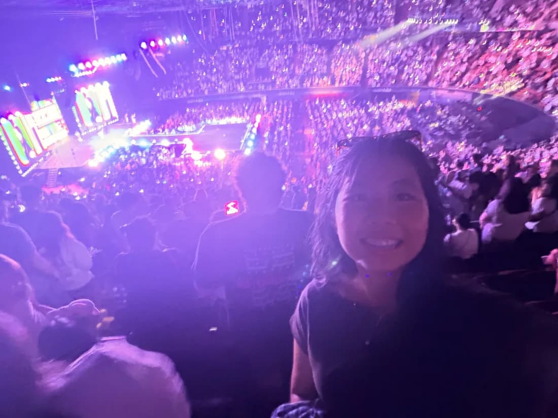 Sue inside a colorful concert arena