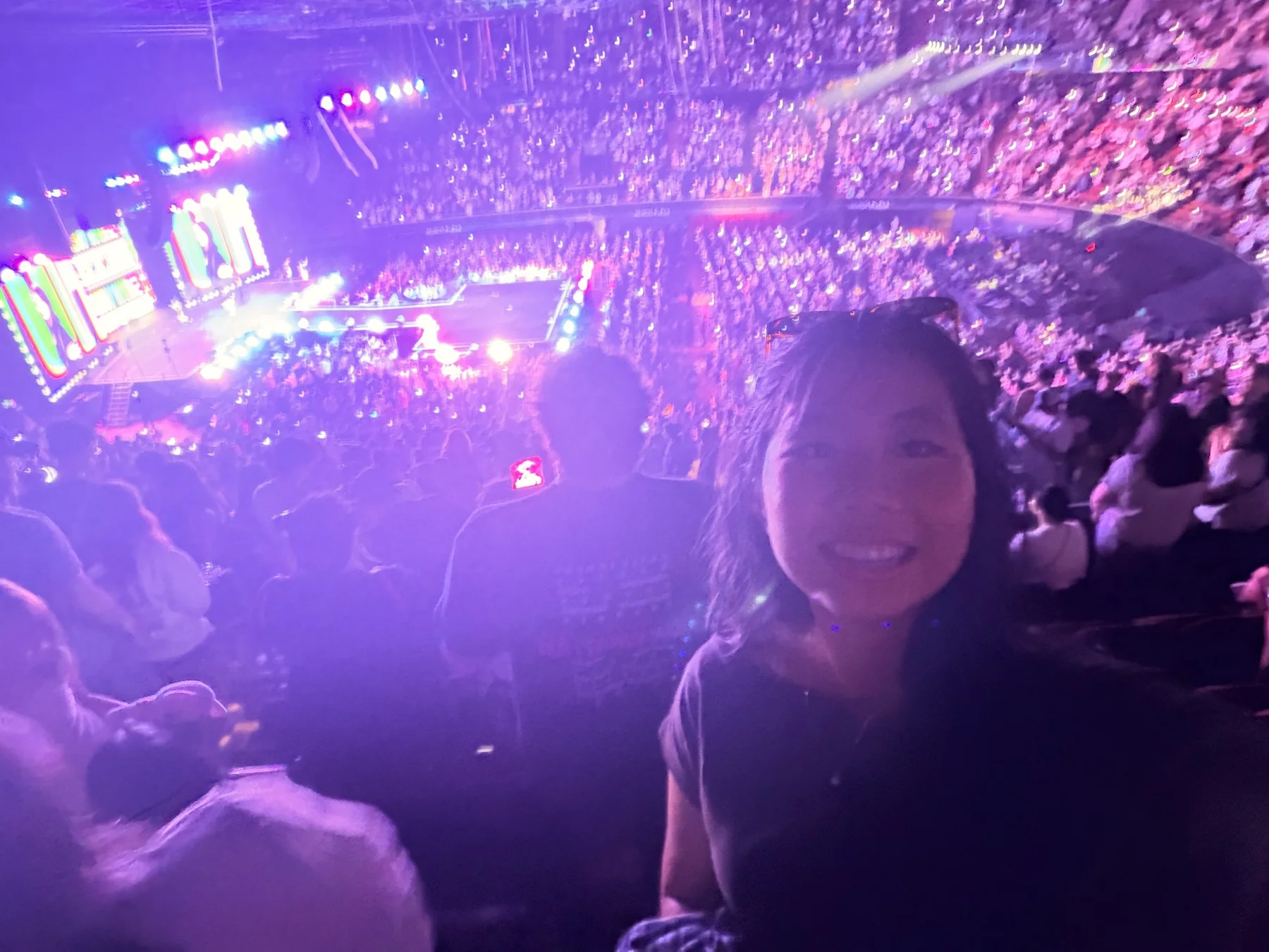 Sue inside a colorful concert arena